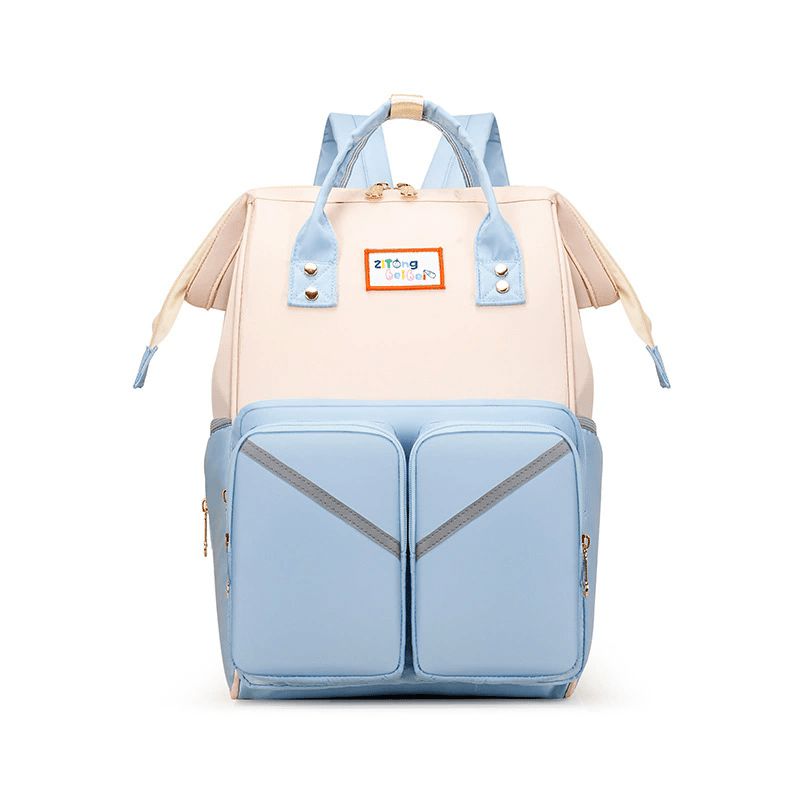 Sac à dos à langer NomaChic hydrofuge bleu et blanc avec compartiments intérieurs pour biberons et produits