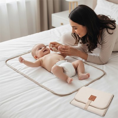 Tapis à langer nomade Aladdin — change serein sur le lit, douceur et hygiène garanties
